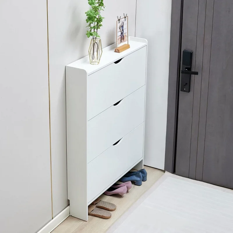 Original white shoe cabinet reference showing three recessed pulls, slim side panels and open floor clearance